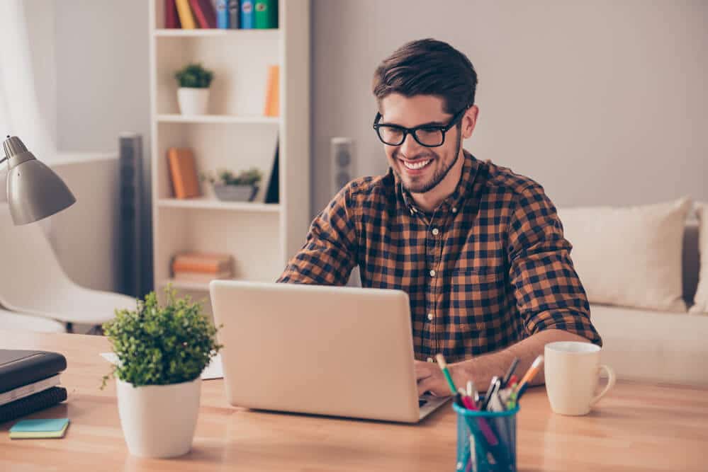 Young Freelance Writer Accepting His First Credit Card Payment Online